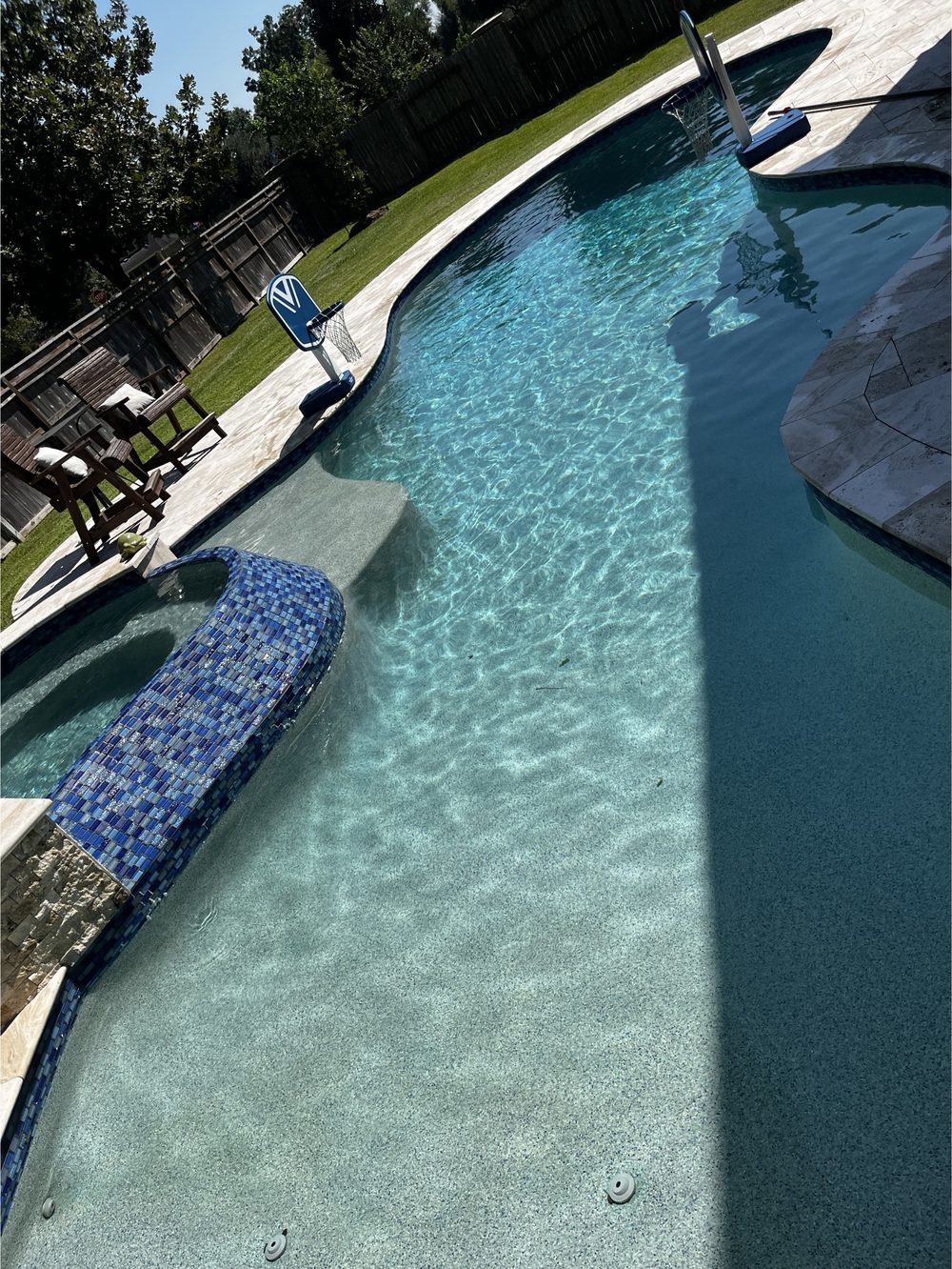 Clean backyard pool in Dripping Springs after a Clean Pool Squad service visit