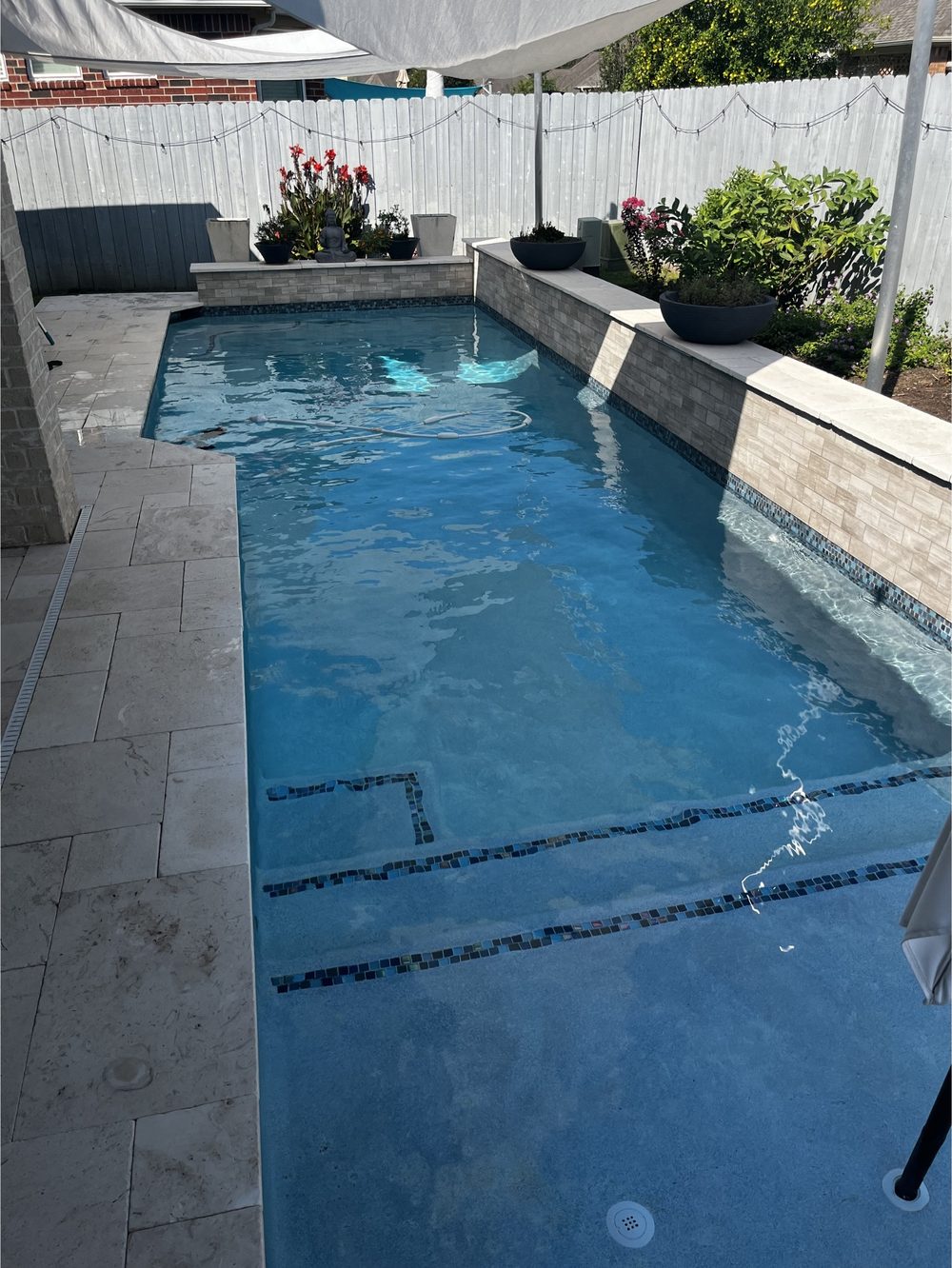 Pool with rock waterfall feature and clean water