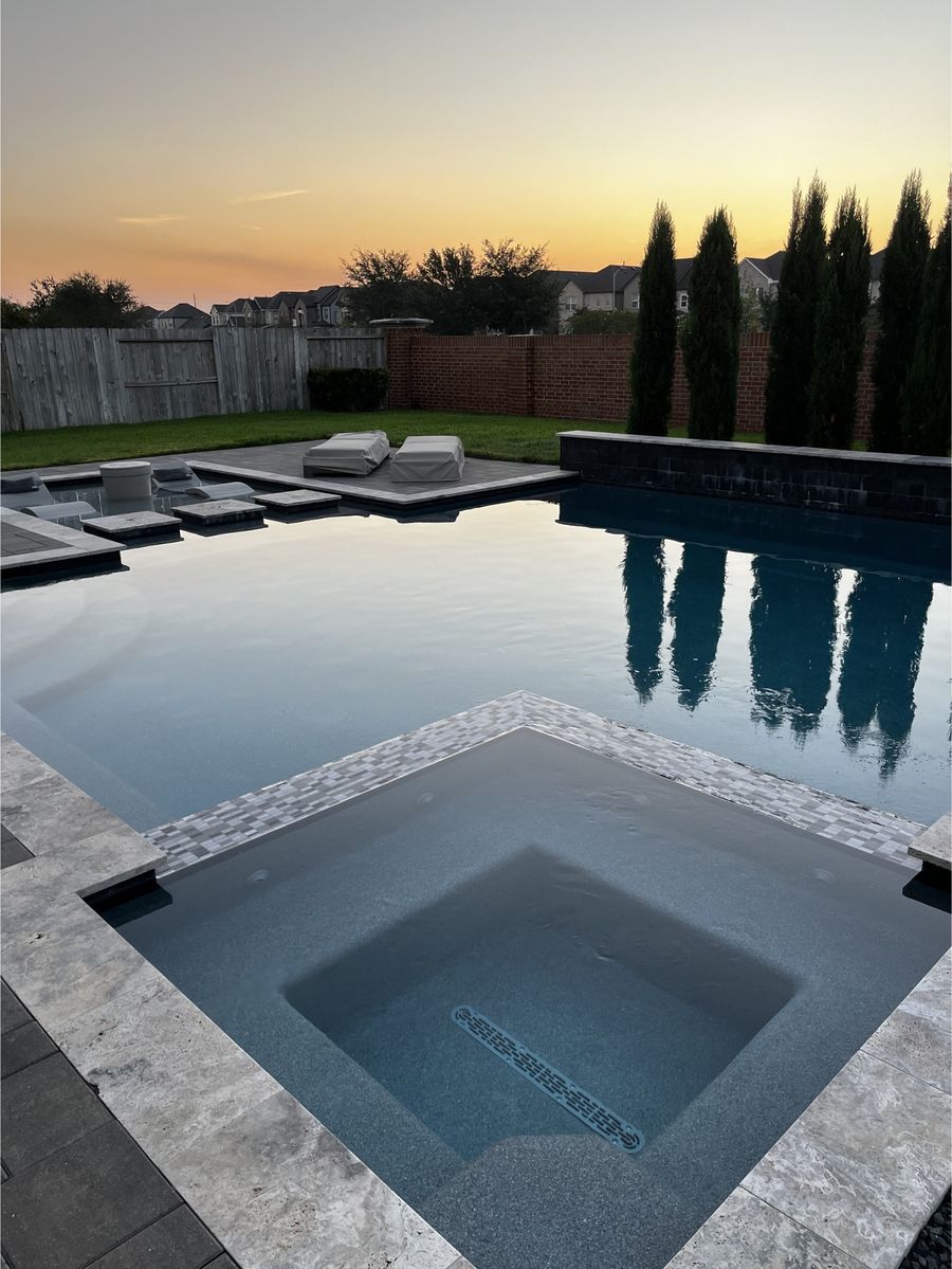 Clean pool and spa at dusk after a weekly Clean Pool Squad service visit
